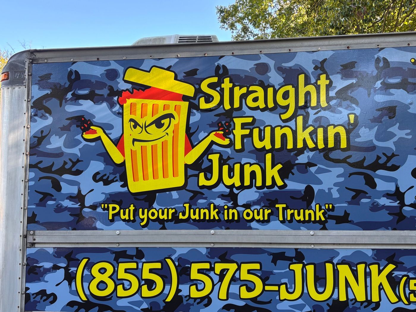 Junky the trash can mascot and the Straight Funkin' Junk logo on the side of the truck